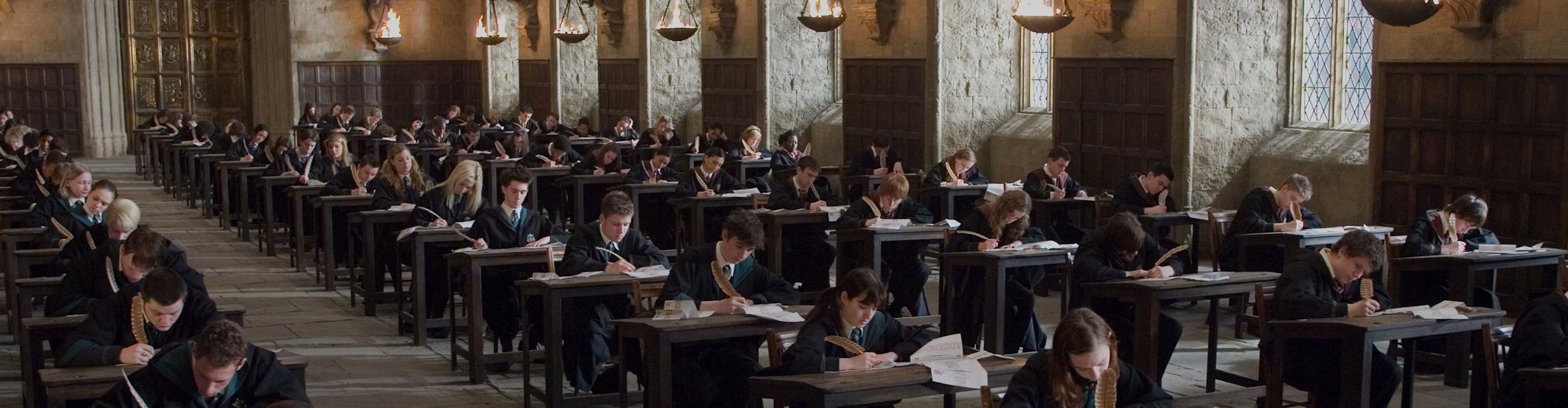 hp-f5-students-desks-owls-exam-great-hall-web-homepage-hero