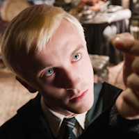 hp-f6-draco-malfoy-examining-feather-serious-app-square
