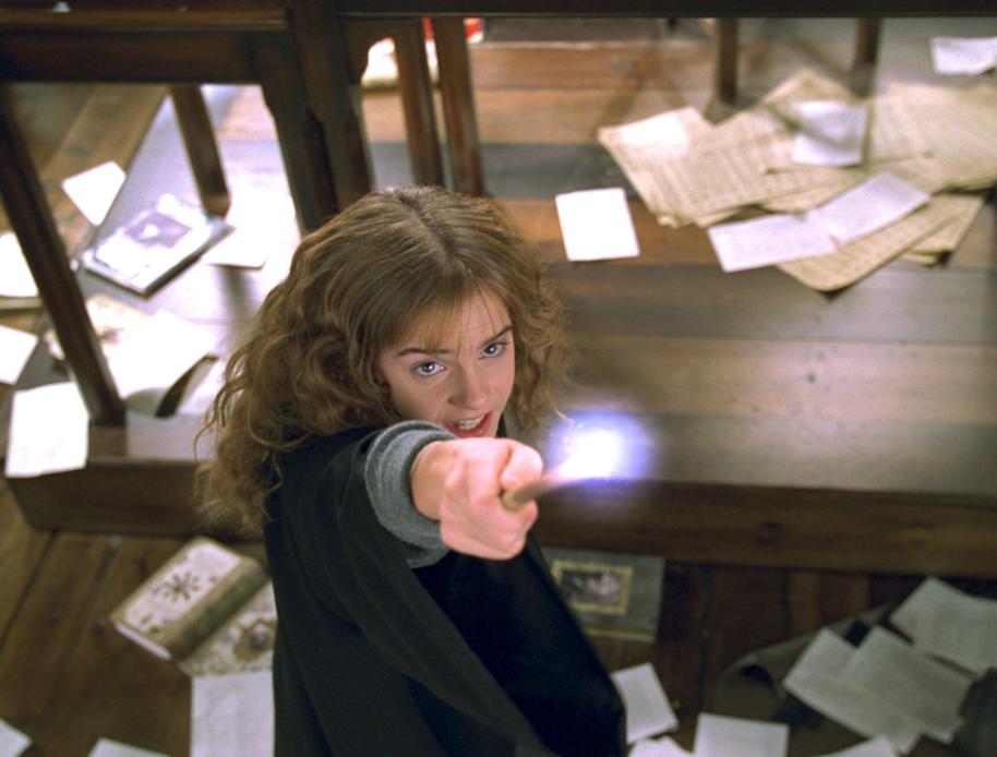 Hermione holding up her wand from the Chamber of Secrets
